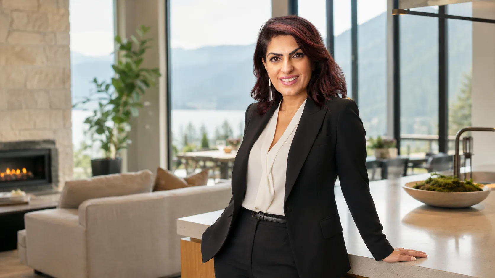 Angela portrait in a bright, modern residential setting with a confident, approachable expression